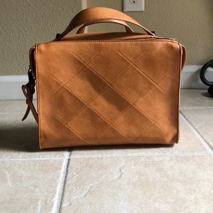 Cute tan color bag, comes with removable strap.